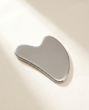 Cryo Gua Sha, bright morning light on warm porcelain