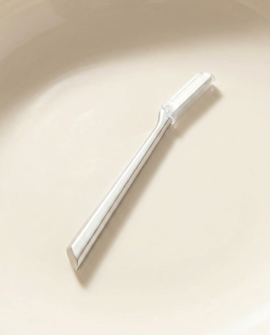 dermaplaning tool detail, morning light